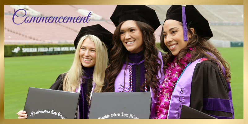 Three Southwestern female graduates holding diplomas and smiling