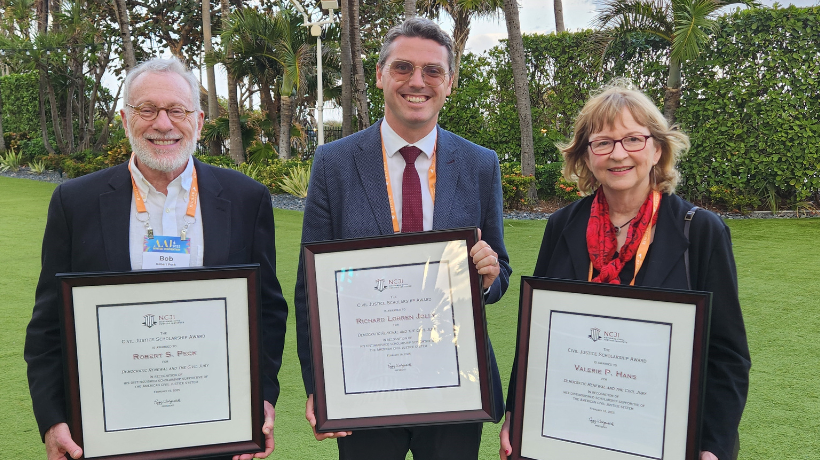 Prof. Jolly posing with his NCJI Award with colleagues