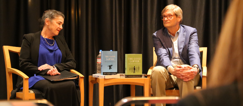 Two panelists speaking on the Good Lawyer book