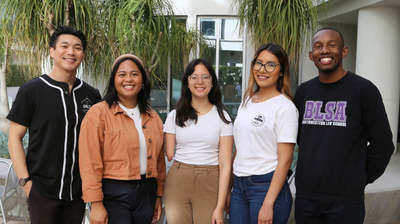 Group photo of five Southwestern students smiling at camera