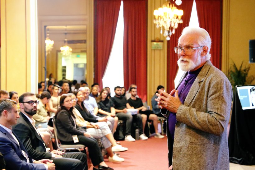 Rex Parris speaking in front of an audience of students at Parris Academy event