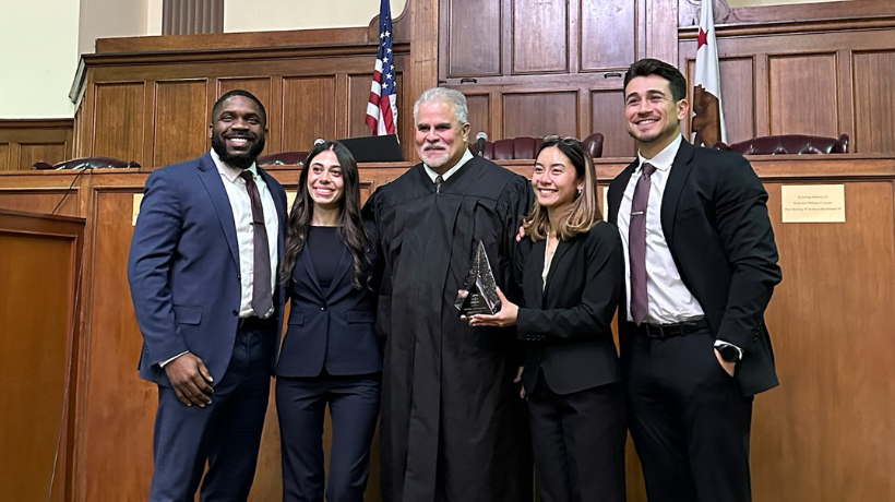 Chinonso Anokwute, Julianna Montano, David Olmedo-Barrera, and Natalie Parsi with Judge at competition