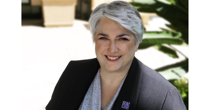 Dean Darby Dickerson Headshot in Black suit