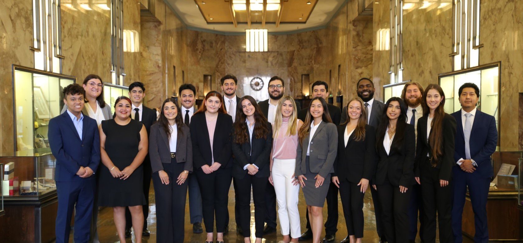 Law students in business professional suits in Bullocks Wilshire lobby