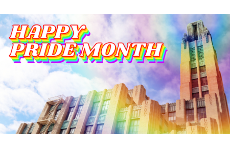 Happy Pride Month against an image of Bullocks Wilshire tower with rainbow halo
